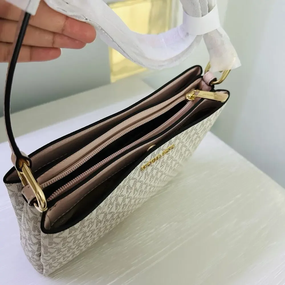 Michael Kors Trisha Medium Logo Crossbody Bag in a vanilla/light cream and pink